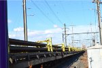 Rail Cars carrying Rail Sections. 